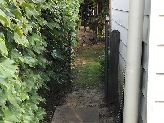 Walkway behind garage