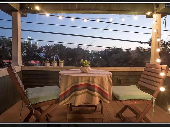 Gorgeous sunsets and twinkling skyline views await on the private patio just off the living room. (Perfect for plants too.)