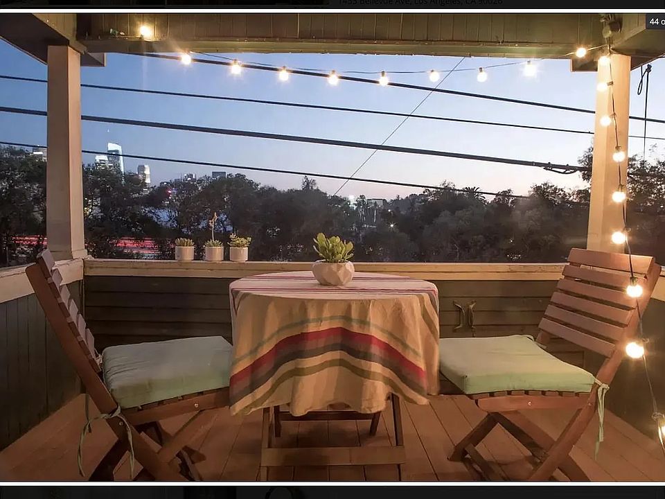 Gorgeous sunsets and twinkling skyline views await on the private patio just off the living room. (Perfect for plants too.)