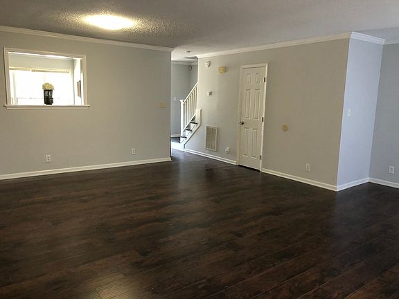 Living room, dining room, and reading nook
