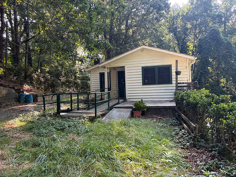 Exterior with wheelchair ramp and porch
