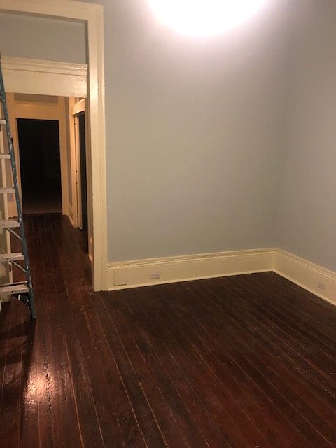 Living room and entry into short hallway