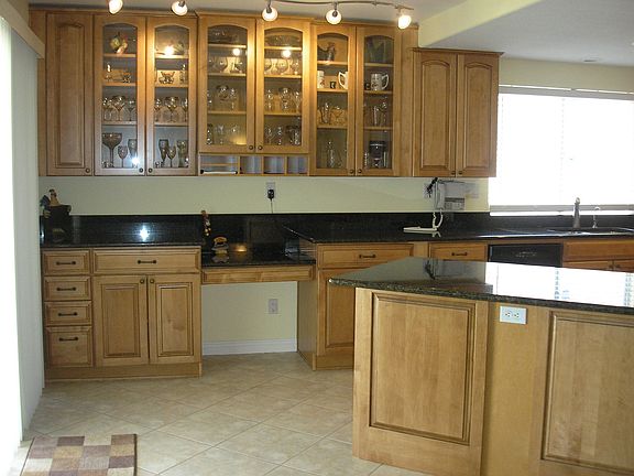 breakfast bar, custom cabinets with glass