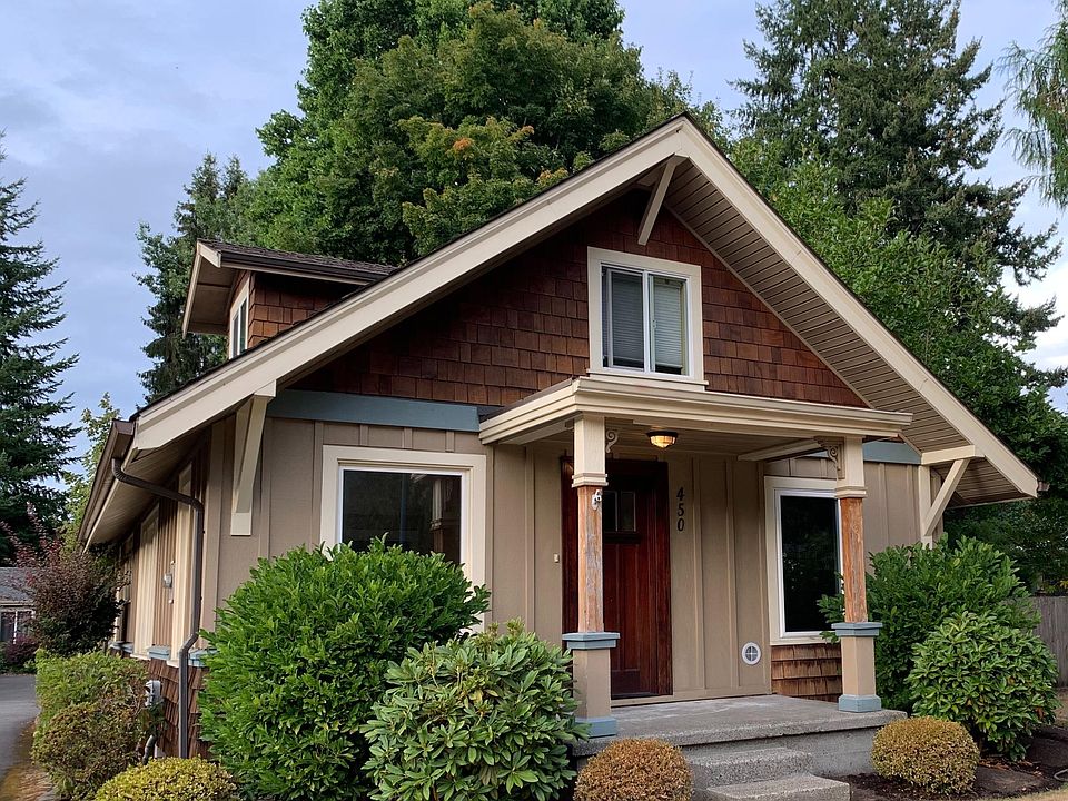 Front of home faces North Street SE in Tumwater. Porch is plenty big for a couple chairs and a table! Additional private fenced courtyard at side of home, to the right in the back.