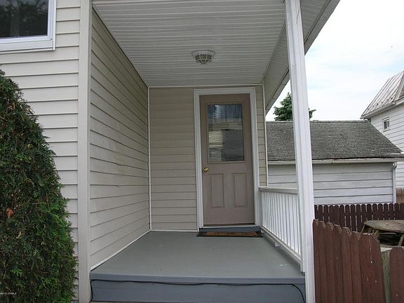 REAR ENTRANCE TO ENCLOSED PORCH