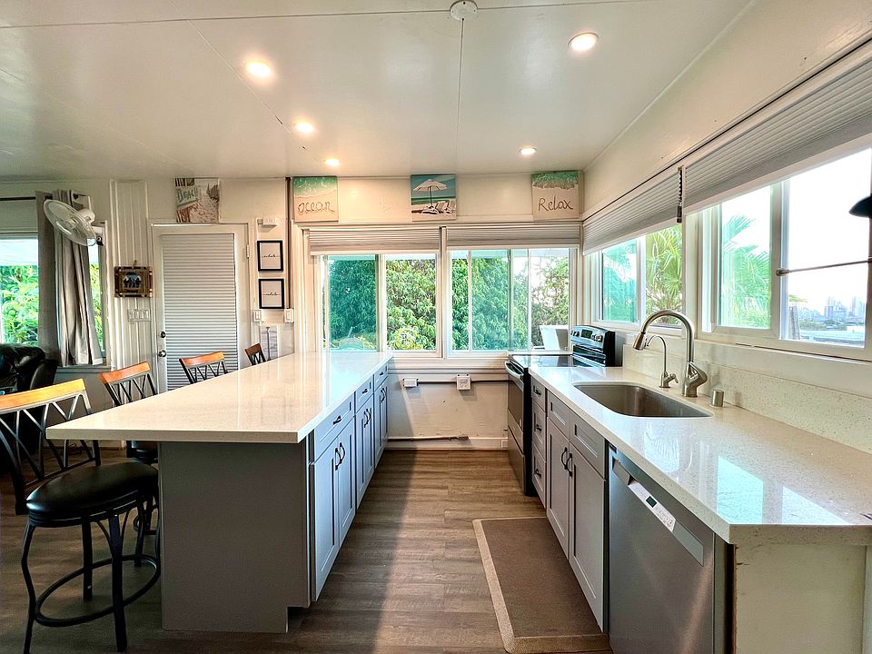 Bright and airy kitchen with natural and recessed lighting