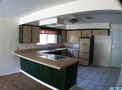 Kitchen boasts new tile counter tops and tile window sill