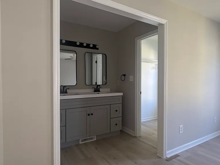 View from main bedroom into bathroom/closet area