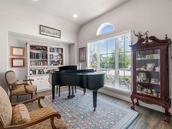 Another view of the study with tile flooring, open niche and large window for natural light, located in the front of the house