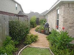 Fully Landscaped - Granite Paths and Flower Beds