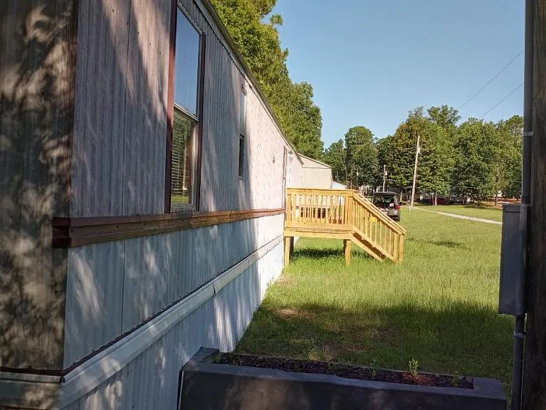 Trailer front with planter and deck.