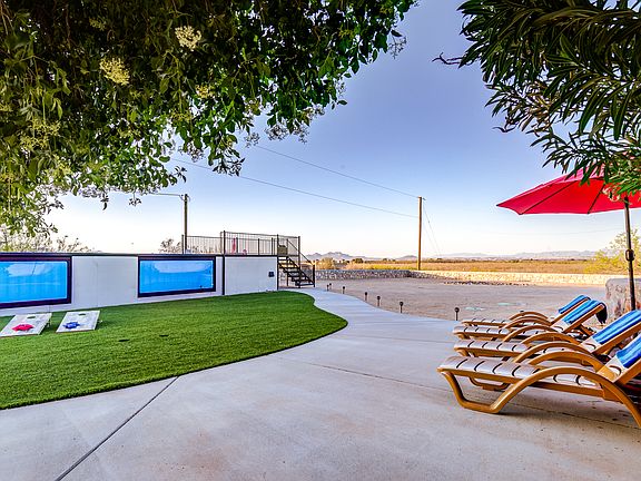 This 20' x 8' climate-controlled container pool is nearly 5 feet deep and features a Baja shelf for lounging. It can be heated to 95_ in colder months or chilled for summer. Artificial turf in front of the pool makes it ideal for year-round hangouts.