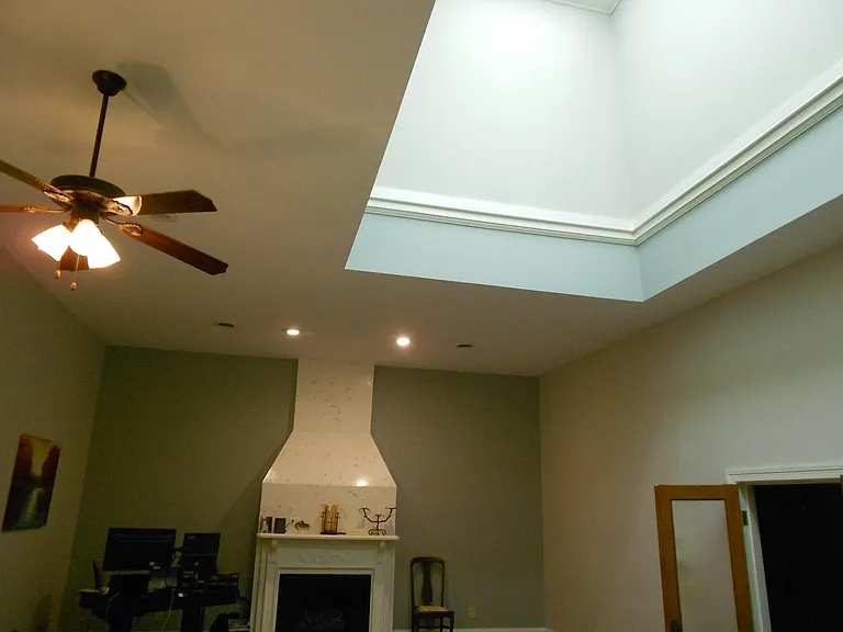 Skylight in master bedroom, artificial lighting.