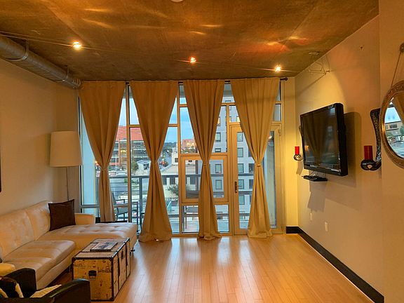 living room facing the unit's outdoor balcony
