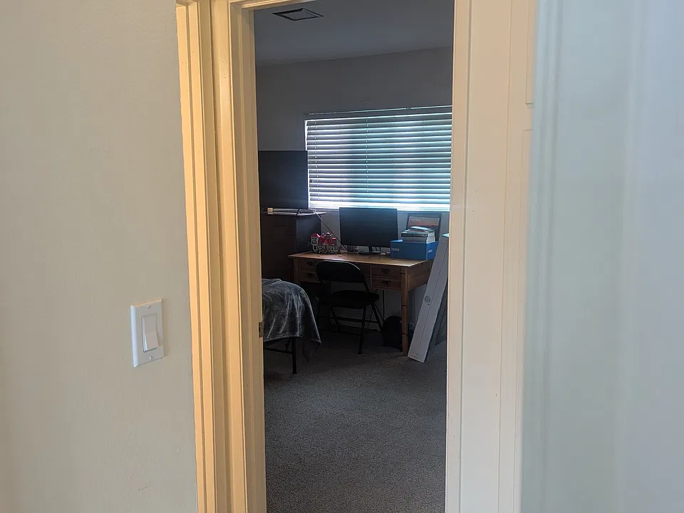 hallway split to both bedrooms and bathroom