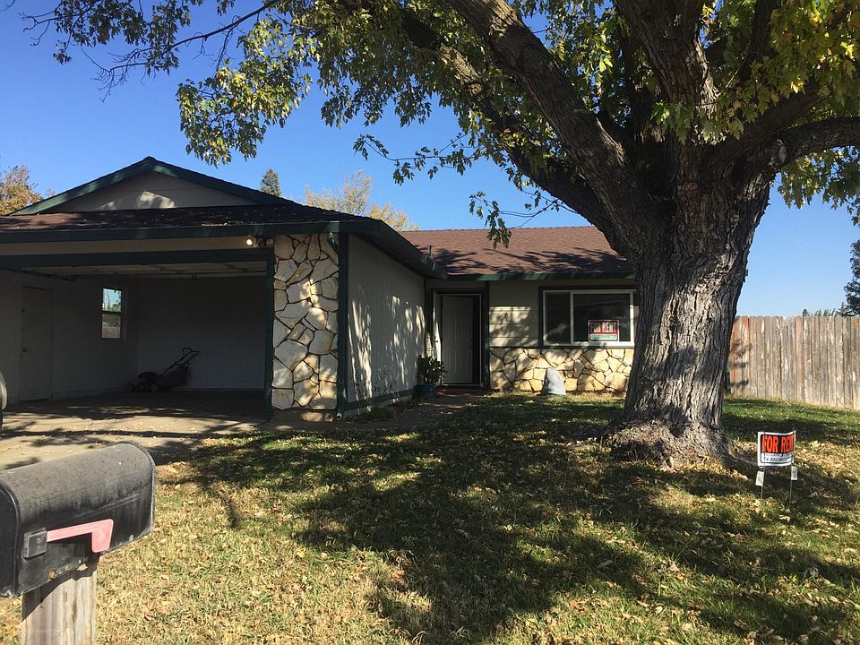 Lovely shaded front entry. Two car garage with lots of space.