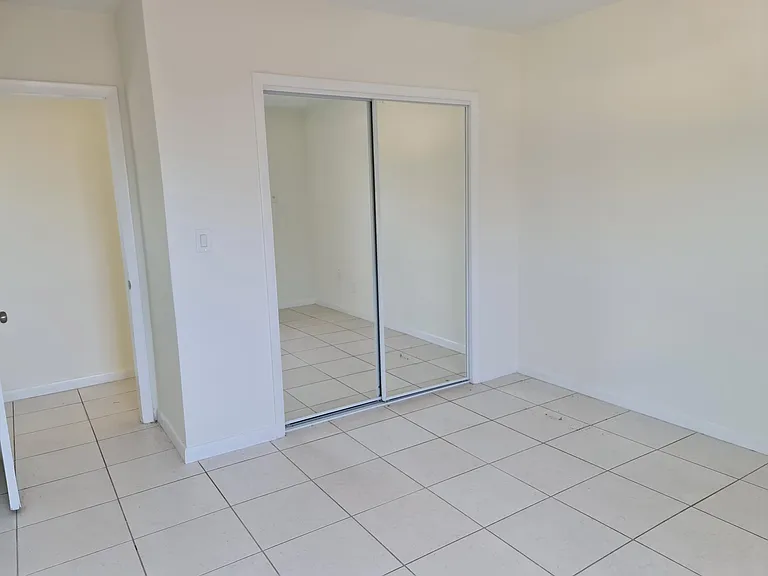 Second bedroom with mirrored closet