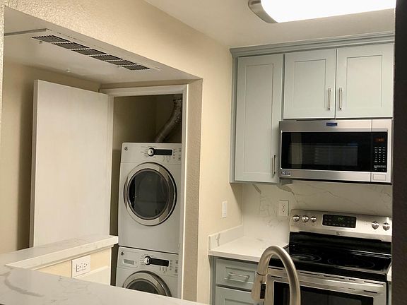 Contemplate kitchen. Super clean and convenient! Convenient washer and dryer.