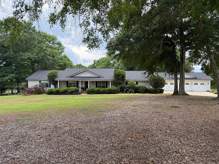 Spacious front yard with well maintained shrubs.