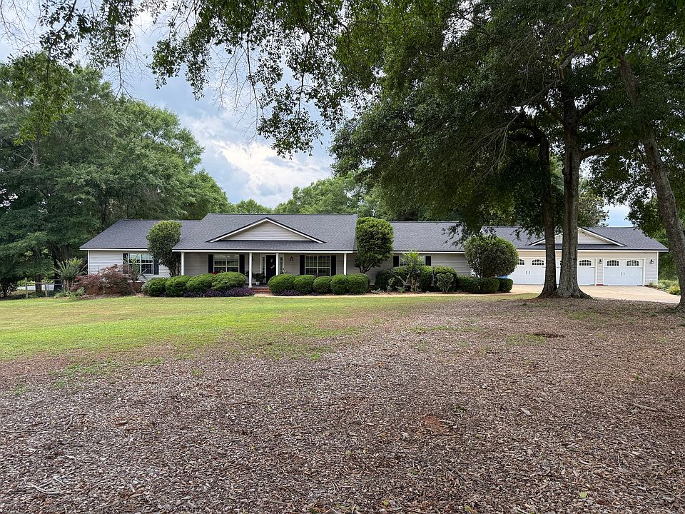 Spacious front yard with well maintained shrubs.