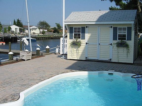 in ground pool overlooking the water