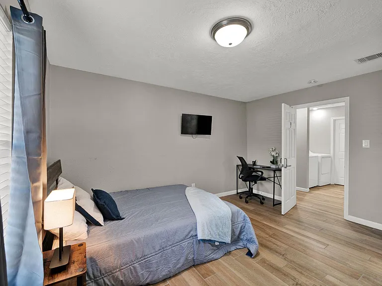Premium room with workspace, blackout curtains, and TV all included