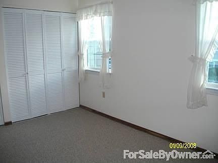 second bedroom : freshly painted, new carpeting and new storm windows with screens.