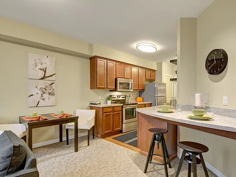 A small breakfast bar and dining area with easy access to the kitchen