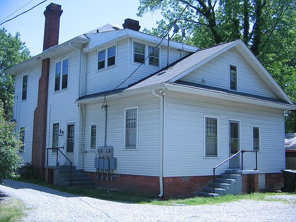 Rear of house w/ off street parking in back.