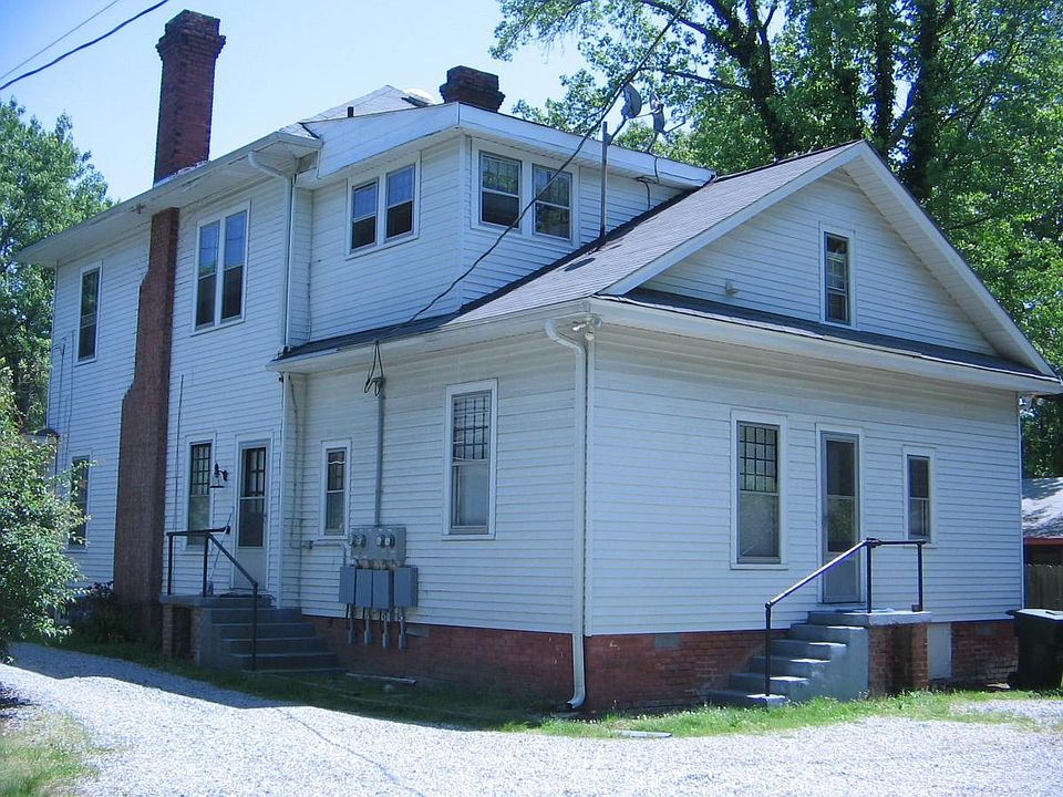 Rear of house w/ off street parking in back.
