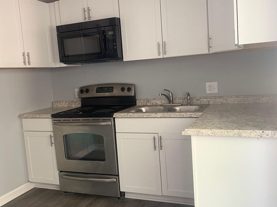 Newly renovated Kitchen with new counter tops, cabinets, and updated appliances.