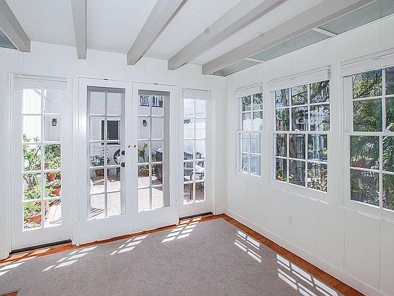 Sunny dining area looking onto courtyard