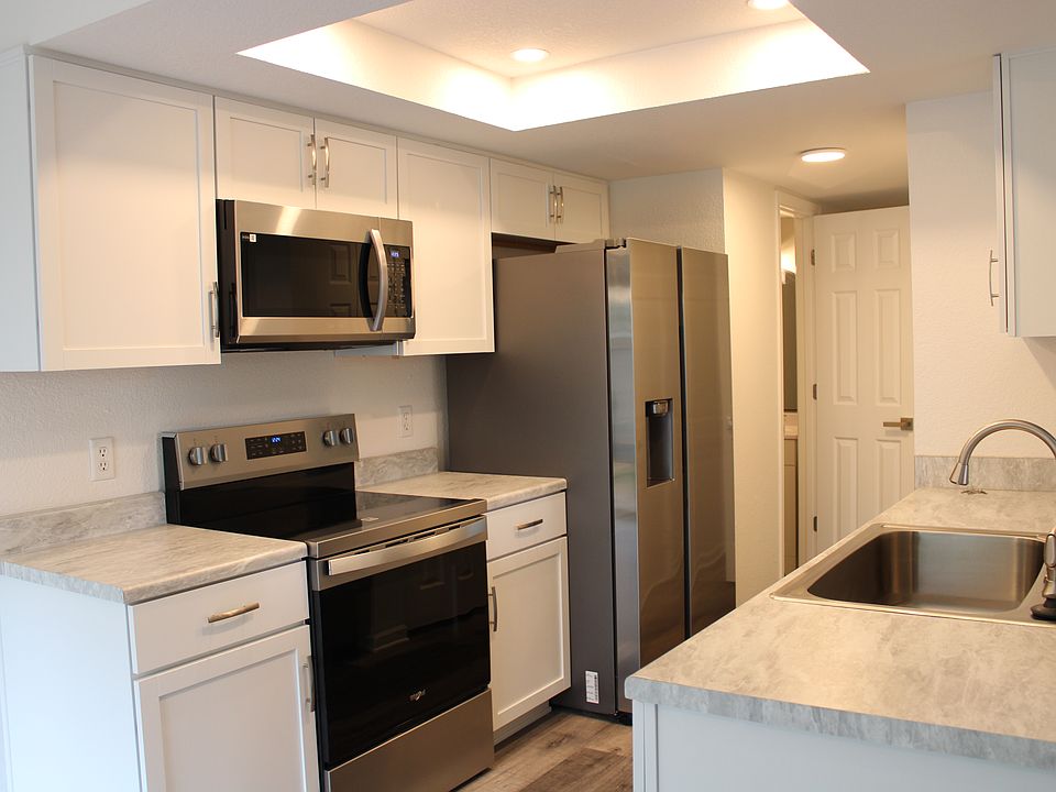 Fully renovated galley style kitchen with new full sized appliances, new countertops and brand new cabinets. Refrigerator features in-door ice maker