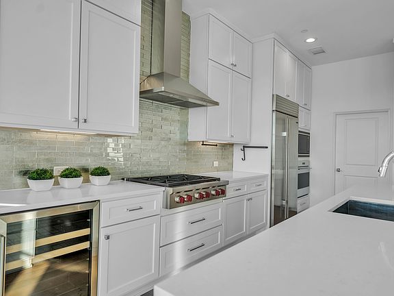 Wolf gas range, Subzero fridge and beverage fridge