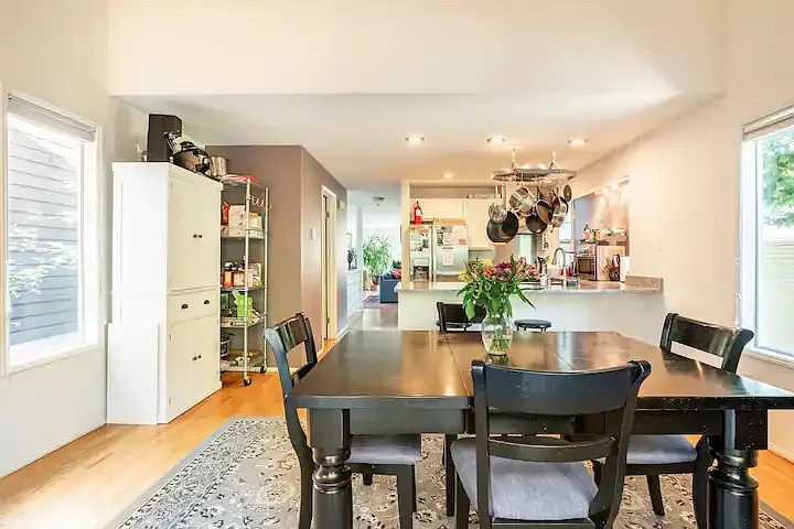 View from the back deck inside at the dining room and kitchen