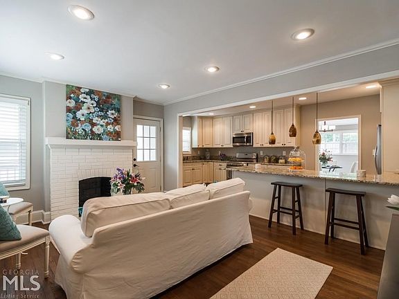 Living Room open to Amazing Chef's Kitchen w access to covered side porch
