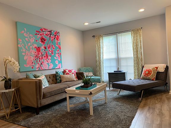 Living Room: Large windows, East facing. Lots of natural sunlight. Canned lights on dimmers, Luxury vinyl flooring.