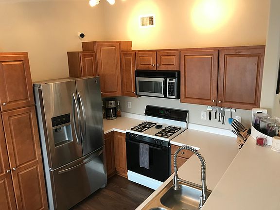 Kitchen with updated stainless steel refrigerator, dishwashe