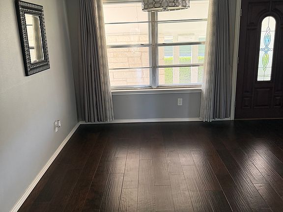 Formal dining room with modern chandelier light (with dimmer feature)
