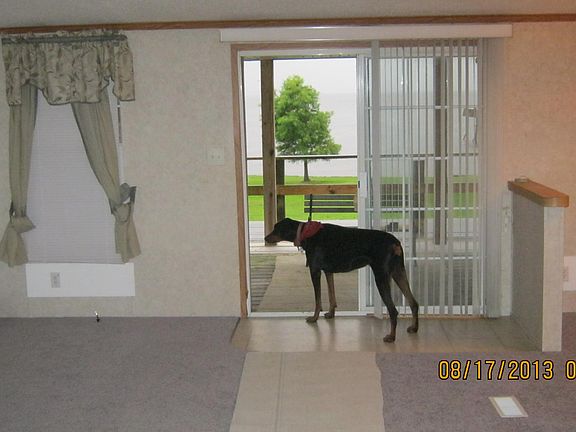 inside livingroom and to the right is dining area