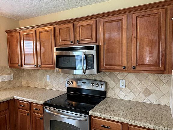 Stainless Steel Appliances (range, builtin microwave, dishwasher) & Beautiful Wood Cabinets