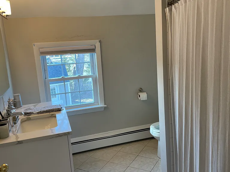 LARGE RECENTLY RENOVATED BATHROOM WITH SHOWER AND TUB