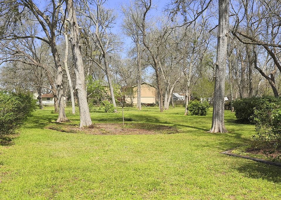 This photo is of the Lot for sale neighboring the owners existing home. Lot is currently being used 
