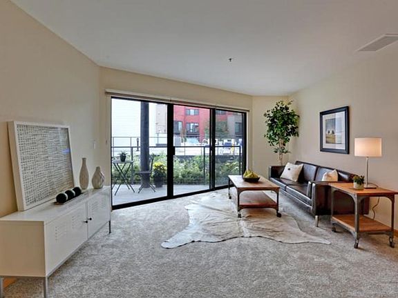 Front Room with window/door to the patio & outdoor lounge ar