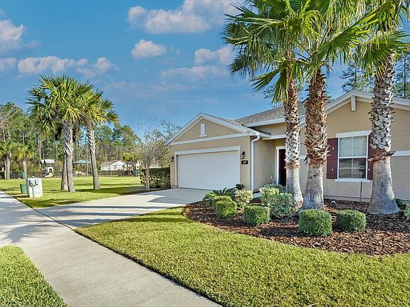 Front of home with field and park next door