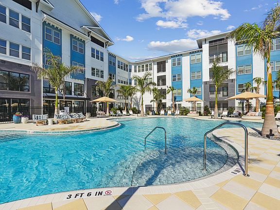 Resort-Style Pool with Sun Shelf and Grilling