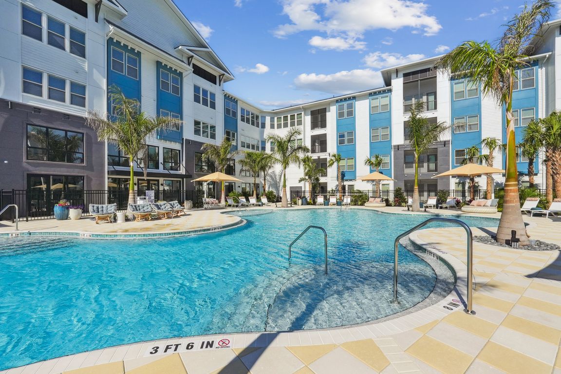 Resort-Style Pool with Sun Shelf and Grilling