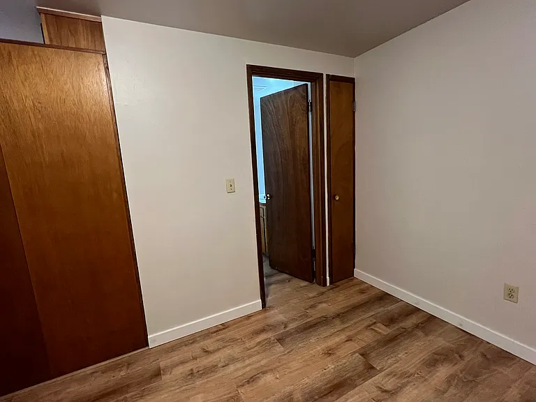 bedroom , linen closet right side of bathroom door