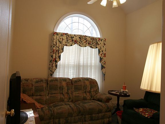 Vaulted ceiling in bedroom currently being used as a den