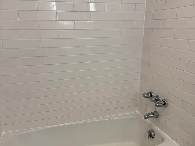 Subway tile surround in shower/tub combo